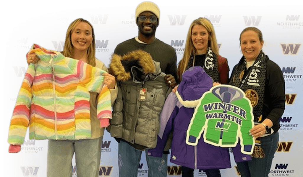 Volunteers distributing warm winter coats to youth in Northern Virginia