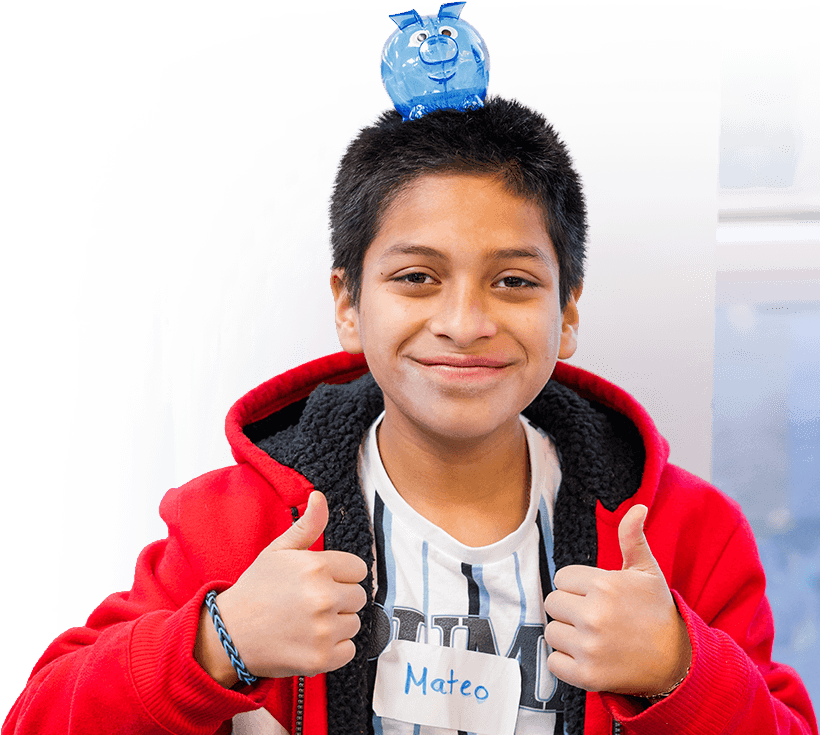 Child balancing pink piggy bank on head, representing youth financial education and savings.